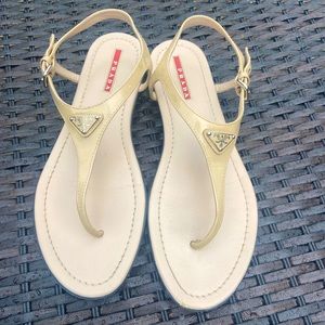 Prada flat sandals - size 11 - ankle strap classic Prada logo displayed on top.